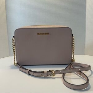 Michael Kors Pink and Gold Crossbody Bag with Sleek Design